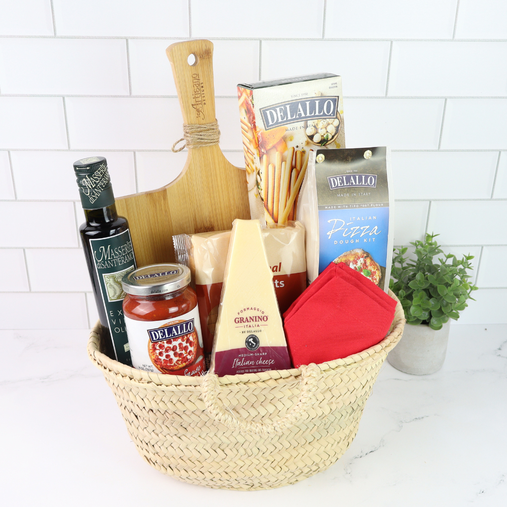 Basket of Delallo pizza-making ingredients on a white tiled background